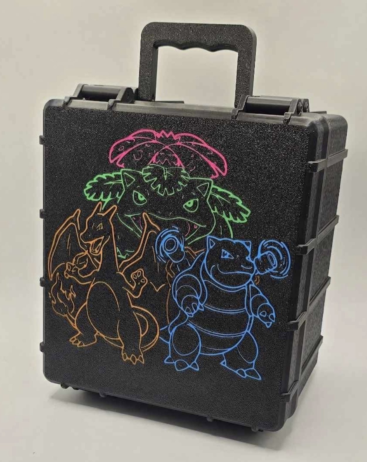 Black custom card case with neon-outline Charizard, Venusaur and Blastoise artwork